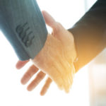 43181042 - business people shaking hands, finishing up a meeting business people shaking hands, finishing up a meeting